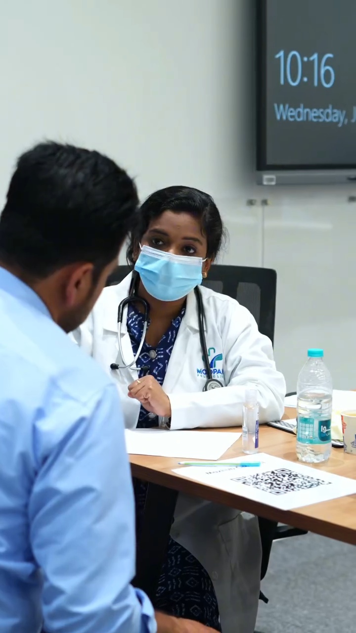 Doctor speaking with a patient during a clinic consultation